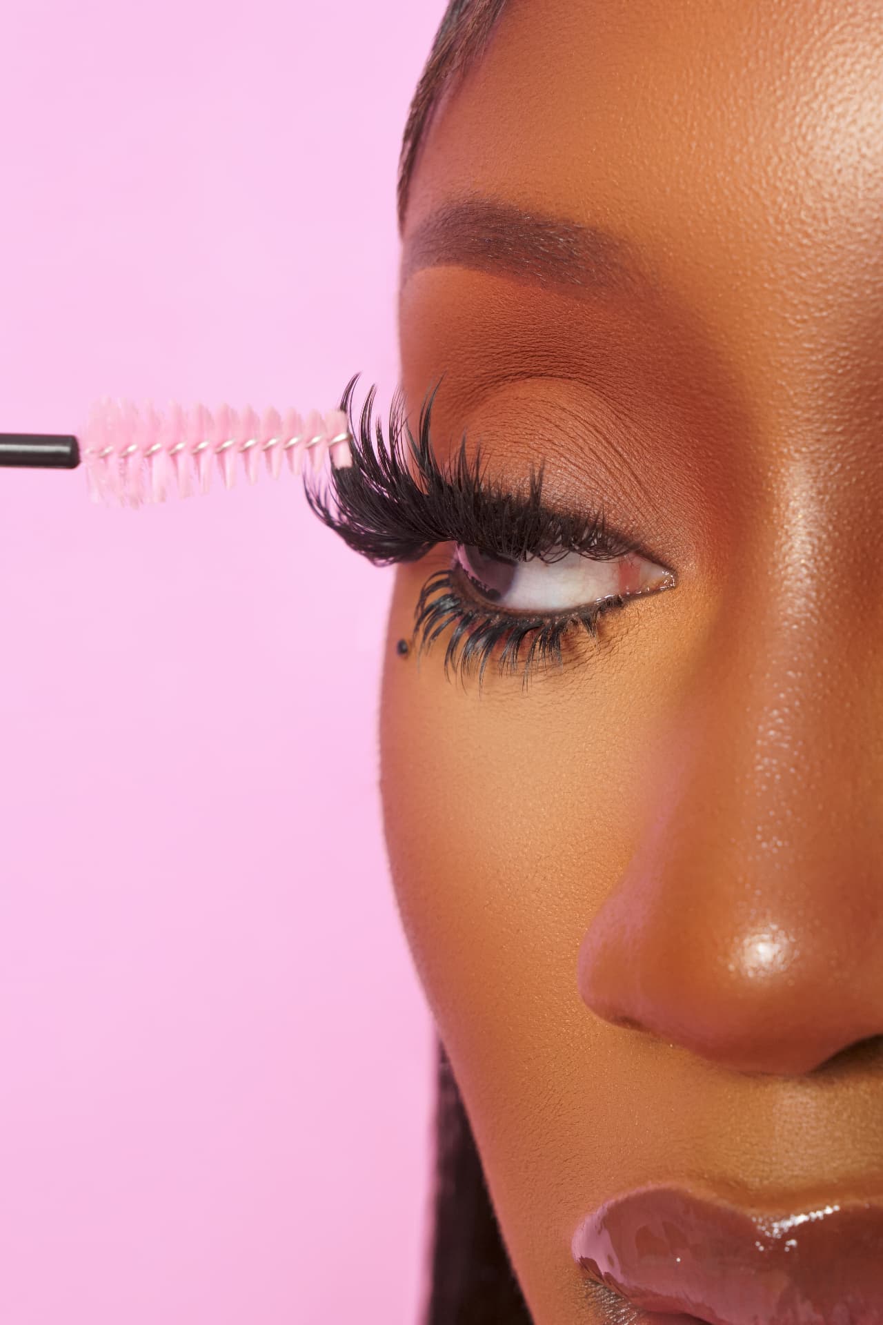 Close-up of a wispy lash set being brushed through at Decardi Beauty